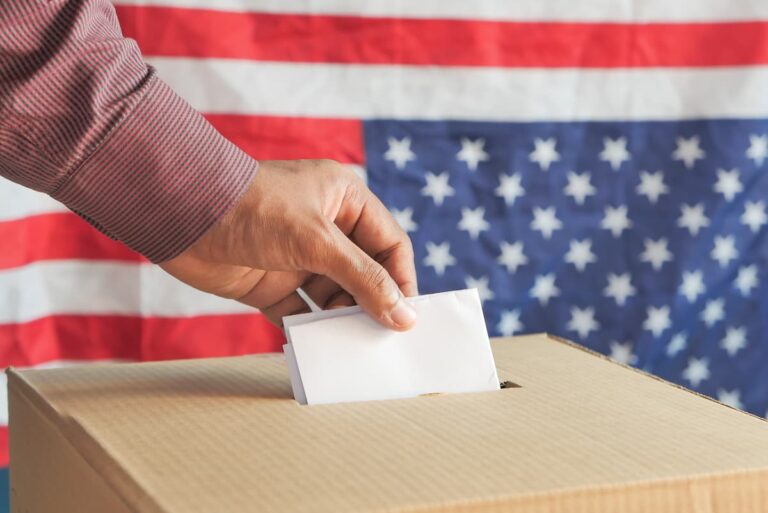 Man's hand putting card box with slot