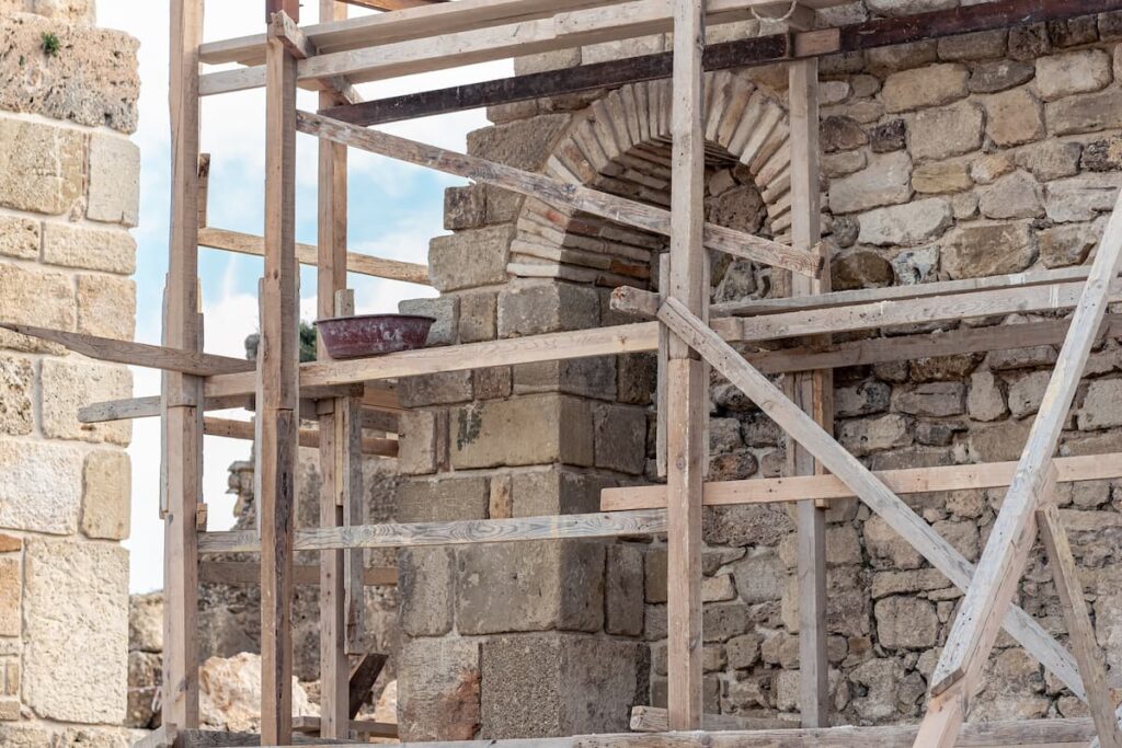 Wooden scaffolding around restored church building